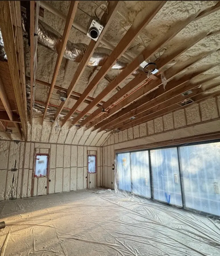 Interior walls and ceiling insulated with spray foam during new construction in New Bern